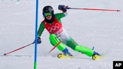 FILE - Atefeh Ahmadi, of Iran competes in the first run of the women's slalom at the 2022 Winter Olympics, Feb. 9, 2022, in the Yanqing district of Beijing. 