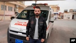 Zaid Ramadan, who recently returned from Minsk with his pregnant wife Delin, after they were caught by Polish authorities, poses for a picture in Dahuk, Iraq, Nov. 20, 2021.