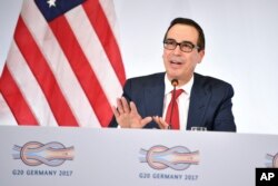 FILE - U.S. Treasury Secretary Steven Mnuchin speaks at a news conference during the G20 finance ministers meeting in Baden-Baden, southern Germany, March 17, 2017.