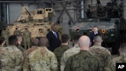 U.S. Defense Secretary Lloyd Austin addressesww U.S. troops stationed at the Powidz Air Base, in Poland, on Feb. 18, 2022