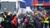 People arrive a temporary accommodation and transport hub for refugees at a former shoping mall, after fleeing the Russian invasion of Ukraine, in Przemysl, Poland, March 6, 2022. 