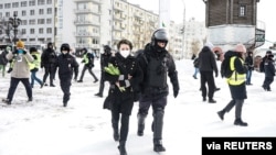 A person is detained during an anti-war protest, following Russia's invasion of Ukraine, in Yekaterinburg, Russia, March 6, 2022.