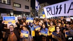 People protest against the Russian invasion of Ukraine, outside the Russian Embassy in Tel Aviv, March 5, 2022.