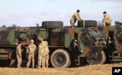 U.S. troops of the 82nd Airborne Division recently deployed to Poland because of the Russia-Ukraine tensions are setting up camp at a military airport in Mielec, southeastern Poland, Feb. 12, 2022.
