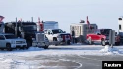 Truckers and their supporters block the Canada-U.S. border in protest against coronavirus disease vaccine mandates and other government policies in Emerson, Manitoba, Canada, Feb. 12, 2022.