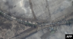 This Maxar satellite image taken and released Feb. 28, 2022, shows the southern end of a Russian military vehicle convoy on T-1011 highway east of Antonov military airport near Kyiv, Ukraine.