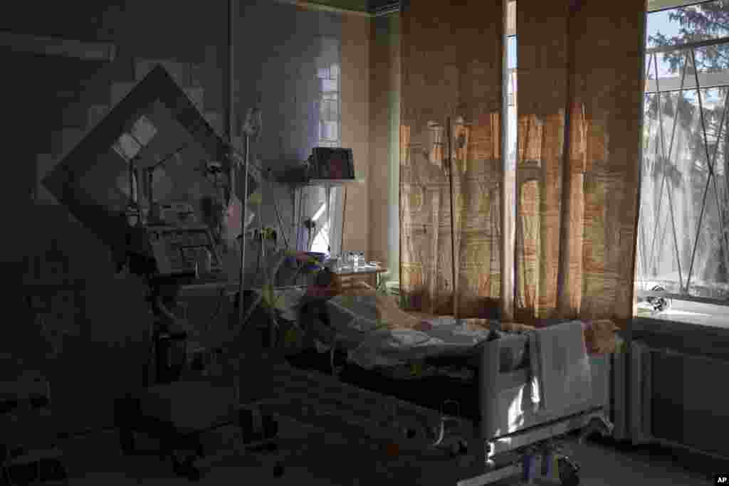 A civilian who was shot while trying to flee lays in the ICU of a hospital in Brovary, north of Kyiv, March 10, 2022.