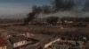 Smoke billows from burning containers after shelling in Vasylkiv, south west of Kyiv, Ukraine, March 12, 2022.