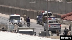 Police officers work in Mogadishu, Somalia, March 23, 2022, in this still image obtained from a social media video. (Twitter/@Hajishire/via Reuters)