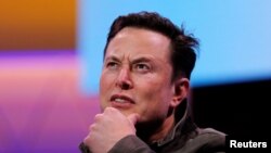 FILE - FILE PHOTO: SpaceX owner and Tesla CEO Elon Musk gestures during a conversation with legendary game designer Todd Howard (not pictured) at the E3 gaming convention in Los Angeles, California, June 13, 2019.