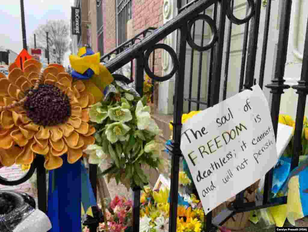 Yellow and blue ribbons, the national colors of Ukraine, adorn the iron railing outside the front door of the Ukraine Embassy, Washington, D.C., March 9, 2022. (Carolyn Presutti/VOA) 