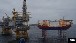 FILE - Platforms producing oil stand in the North Sea over the Johan Sverdrup oil field, 140 kilometers west of Stavanger, Norway, Dec. 3, 2019.