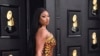 Rapper Megan Thee Stallion tiba di acara penghargaan Grammy ke-64 di MGM Grand Garden Arena di Las Vegas, pada 3 April 2022. (Foto: Invision/AP/Invision/AP