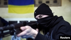 A civilian who volunteered to join the Territorial Defense Forces trains on weapons, following Russia's invasion of Ukraine, in Odessa, Ukraine, March 7, 2022. 