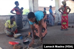 Victims of Tropical Storm Ana preparing food at an evacuation camp in Phalombe district, Malawi, Feb. 3, 2022.