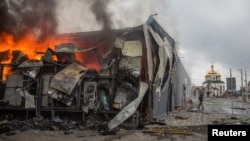 Fire burns in a building after a shelling, as Russia's attack on Ukraine continues, in the town of Irpin, Kyiv region, Ukraine March 30, 2022.