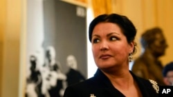 FILE - Russian soprano Anna Netrebko answers reporters' questions prior to the start of a news conference to present Giuseppe Verdi's 'Macbeth' at the La Scala opera house, in Milan, Italy, Nov. 29, 2021.