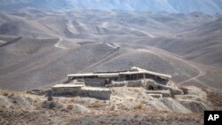 FILE - A distant view of Mes Aynak valley, southwest of Kabul, Afghanistan, Oct. 30, 2021.