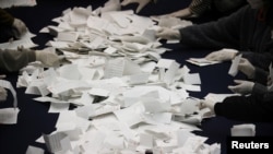 National Election Commission officials count ballots for the presidential election in Seoul, South Korea, March 9, 2022. 