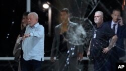 Brazil's President Luiz Inacio Lula da Silva inspects the damage at Planalto Palace after it was stormed by supporters of Brazil's former President Jair Bolsonaro in Brasilia, Brazil, Jan. 8, 2023.