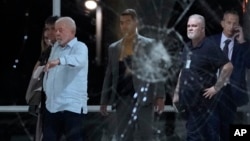 Brazil's President Luiz Inacio Lula da Silva inspects the damage at Planalto Palace after it was stormed by supporters of Brazil's former President Jair Bolsonaro in Brasilia, Brazil, Jan. 8, 2023.