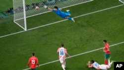 Croatia's Josko Gvardiol, second right, scores the opening goal during the World Cup third-place playoff soccer match between Croatia and Morocco at Khalifa International Stadium in Doha, Qatar, Dec. 17, 2022. 