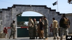 FILE - Security stands guard in front of the Pakistan embassy in Kabul, Afghanistan, Nov. 4, 2019.