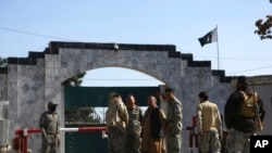 FILE - Security stands guard in front of the Pakistan embassy in Kabul, Afghanistan, Nov. 4, 2019. On Dec. 2, 2022, two ISIS-K gunmen opened fire on the embassy in an attempt to assassinate the head of the diplomatic mission. The target escaped unharmed, but a guard was shot.