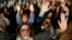 FILE - Women protest against a Spanish court which sentenced five of six men accused of gang-raping a 14-year-old girl to 10 to 12 years in prison for sexually abusing the minor, but acquitted them of rape, outside the Justice Ministry in Madrid, Spain, N