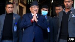 Nepal's former guerrilla leader Pushpa Kamal Dahal (2L), better known as Prachanda, leaving the president's office to claim majority for his appointment as the new prime minister, in Bhaktapur on the outskirts of Kathmandu, Dec.25, 2022. 