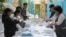 Election commission members count ballots at a polling station in Almaty, Kazakhstan, Nov. 20, 2022. 