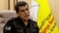 FILE - Syrian-Kurdish commander Mazloum Abdi of the U.S.-backed Syrian Democratic Forces speaks during a news conference in Hasakah, Syria, Nov. 26, 2022. 