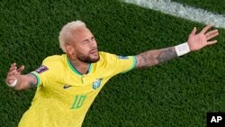 Brazil's Neymar celebrates scoring his side's second goal during the World Cup round of 16 soccer match between Brazil and South Korea, at the Education City Stadium in Al Rayyan, Qatar, Dec. 5, 2022.