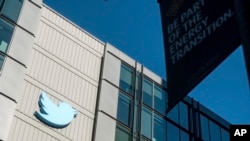 FILE - A Twitter logo is displayed outside the company's San Francisco offices, Nov. 1, 2022. 