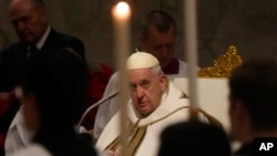 Pope Francis presides over Christmas Eve Mass, at St. Peter's Basilica at the Vatican, Dec. 24, 2022.