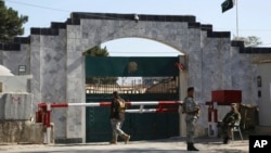 FILE - Security stands guard outside the Pakistan Embassy in Kabul, Afghanistan, Nov. 4, 2019.