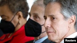 U.S. Secretary of State Antony Blinken, right, participates in a World AIDS Day event in Washington, Dec. 2, 2022. The same day, he said the U.S. had designated China, Iran and Russia, among others, as countries of particular concern under the Religious Freedom Act.