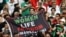 Iran fans hold a banner reading 'Woman life freedom' inside the stadium during the Group B match between England and Iran at Khalifa International Stadium, Doha, Qatar, on Nov. 21, 2022.