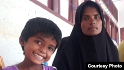 Rohingya refugee Hatemon Nesa, 27, and her daughter Umme Salima, 5, after being rescued in Aceh, Indonesia on Dec. 26, 2022.