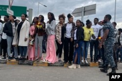 Relatives wait for the passengers arriving from Tigray at the Bole International Airport in Addis Ababa, Dec. 28, 2022.
