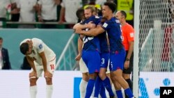 U.S players celebrate after the World Cup group B soccer match between Iran and the United States at Al Thumama Stadium in Doha, Qatar, Nov. 29, 2022. 