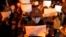 Protesters hold up blank papers and chant slogans as they march in Beijing, Nov. 27, 2022. 