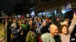 Protesters march in Tel Aviv, Israel, against Prime Minister Benjamin Netanyahu's far-right government, Jan. 7, 2023. 