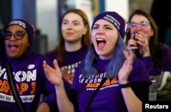 Women cheer during a Reproductive Freedom For All watch party on election night in Detroit, Michigan, November 8, 2022.