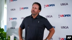 Phil Mickelson ponders a question at a press conference, June 13, 2022, at The Country Club in Brookline, Massachusetts, ahead of the U.S. Open golf tournament that begins Thursday, June 16.