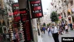A man walks past a currency exchange office in Istanbul, Turkey, June 10, 2022. 