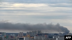 FILE - This photograph taken on June 5, 2022 shows smoke after several explosions hit the Ukrainian capital Kyiv early morning.