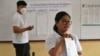 Cambodian election officials count ballots at a polling station during local commune elections in Phnom Penh, June 5, 2022. 
