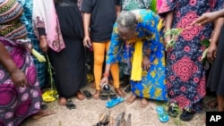Women protest at a market following an attack on St. Francis Catholic Church in Owo, Ondo state, Nigeria, June 7, 2022. Officials said the June 5 attack was carried out by extremist rebels under the Islamic State West Africa Province group.