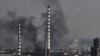 Smoke and dirt rise from the city of Sievierodonetsk during fighting between Ukrainian and Russian troops at the eastern Ukrainian region of Donbas on June 14, 2022. 